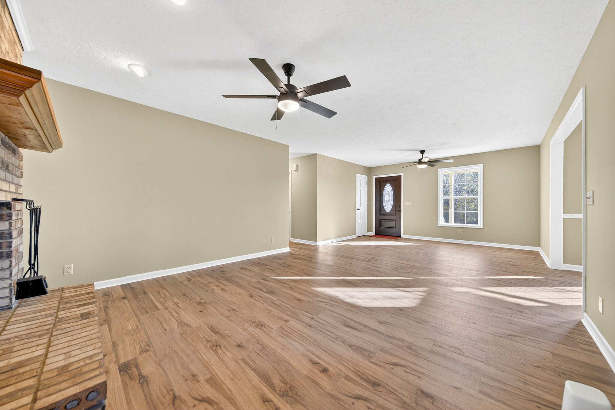 226 West Biggs Road Cottontown, TN 37048 - Photo 31 of 56 a view of empty room with wooden floor and fan