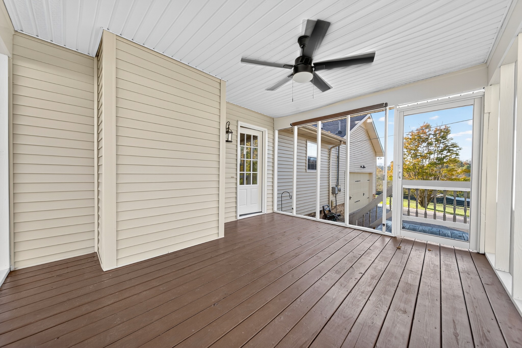 226 West Biggs Road Cottontown, TN 37048 - Photo 33 of 56 an empty room with wooden floor fan and windows