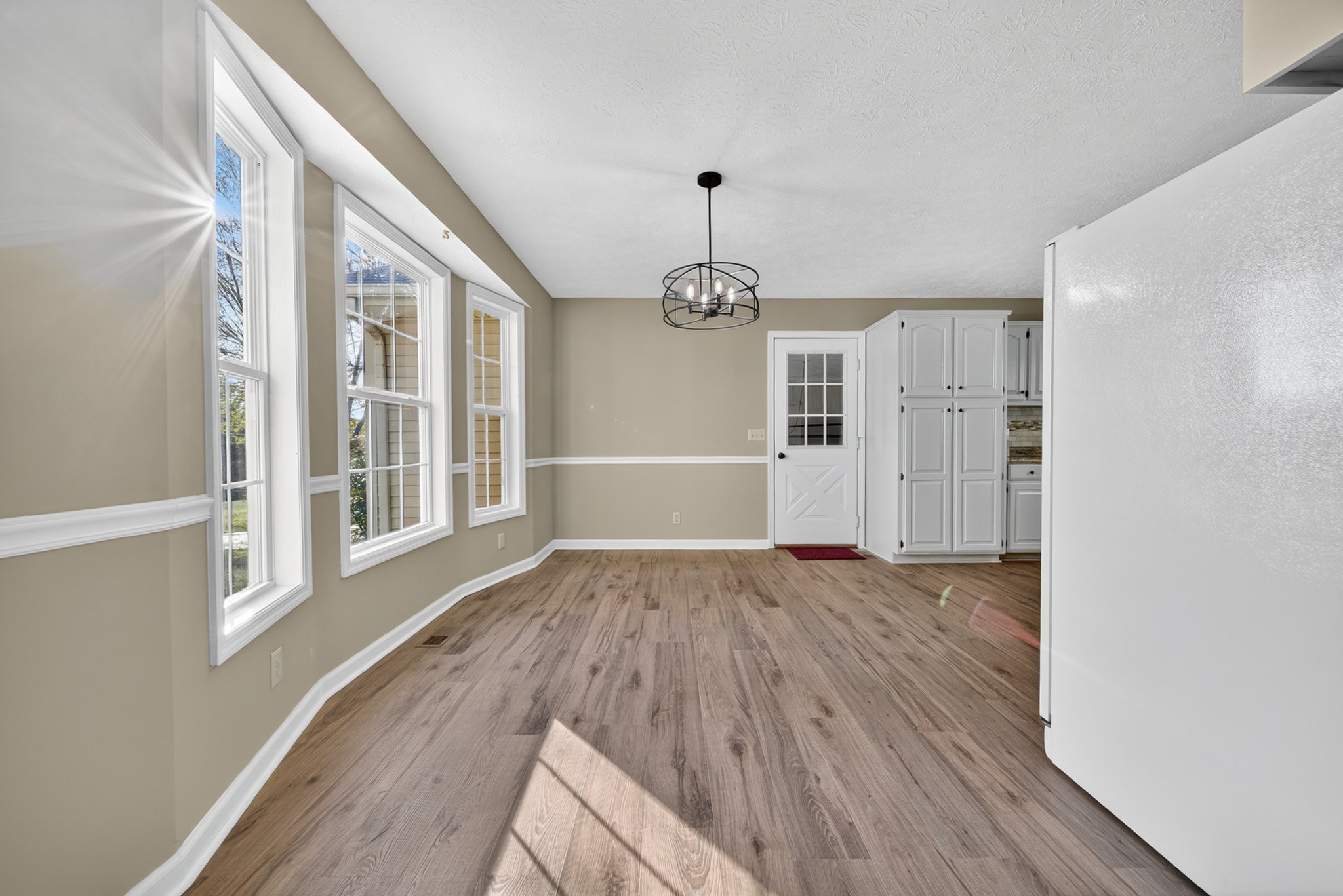 226 West Biggs Road Cottontown, TN 37048 - Photo 34 of 56 a view of an empty room with wooden floor and a window