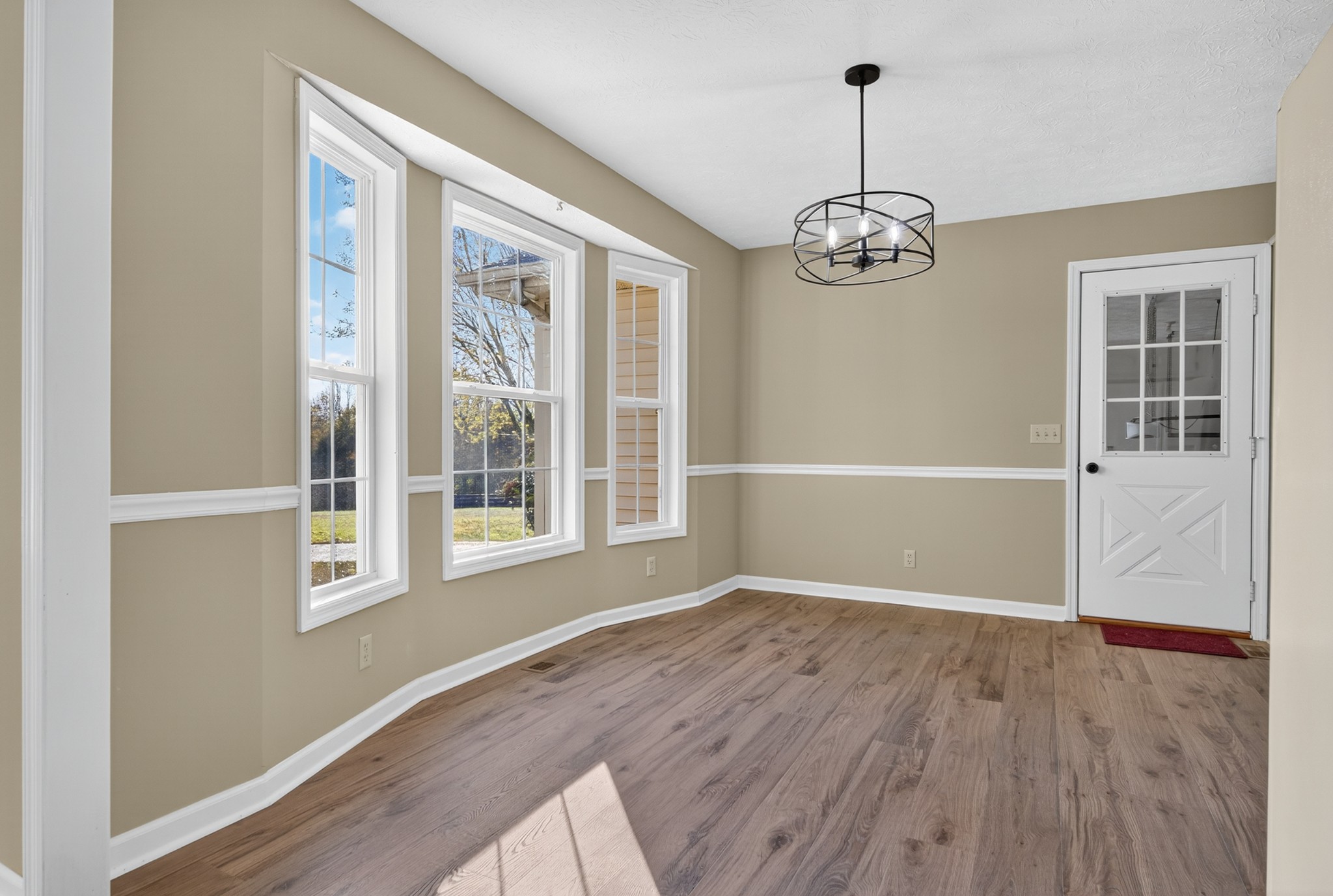 226 West Biggs Road Cottontown, TN 37048 - Photo 35 of 56 a view of an empty room with wooden floor and a window