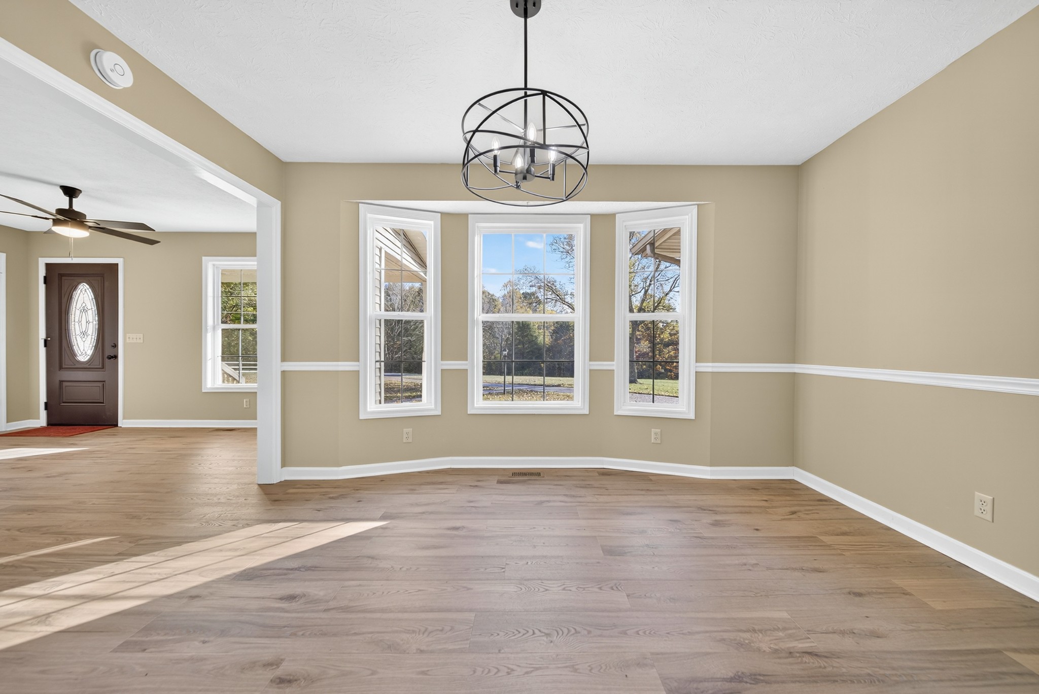 226 West Biggs Road Cottontown, TN 37048 - Photo 36 of 56 a view of an empty room with wooden floor and fan
