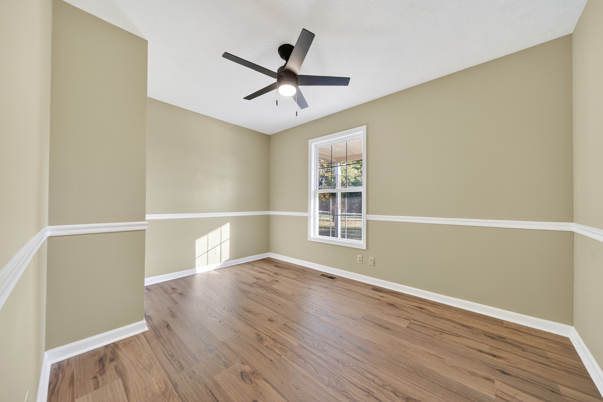 226 West Biggs Road Cottontown, TN 37048 - Photo 49 of 56 wooden floor in an empty room with a window