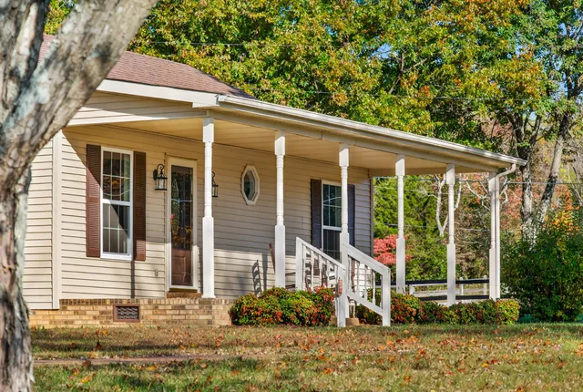 front view of a house with a yard