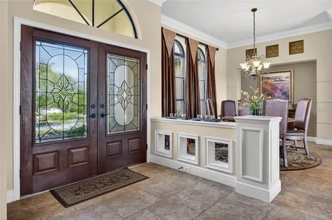 a living room with furniture fireplace and flat screen tv