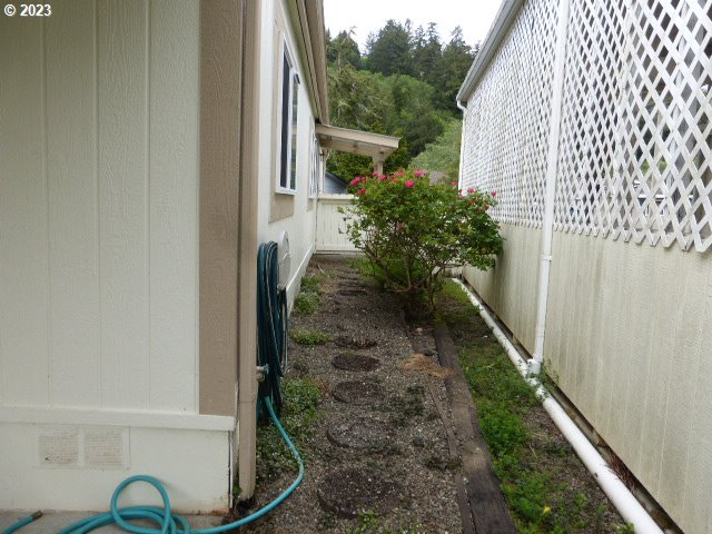 100 River Bend Road, Unit 65 Reedsport, OR 97467 - Photo 21 of 21 a view of a balcony with chair