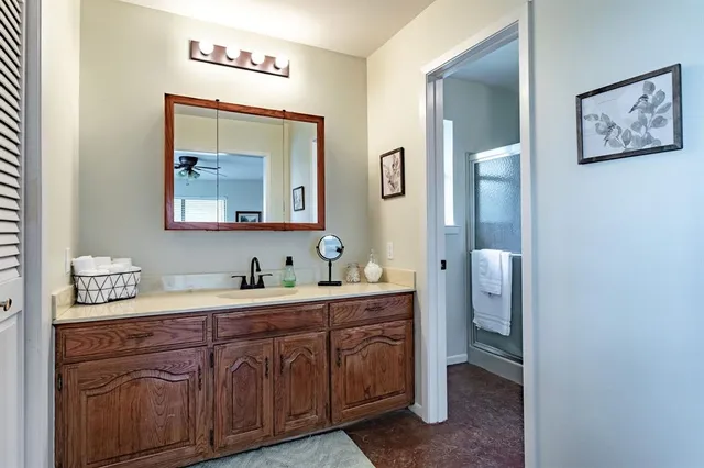 a en suite bathroom with a toilet sink and mirror