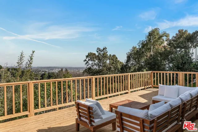 a view of a chairs and table on the deck