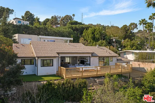 a front view of a house with a yard table and chairs