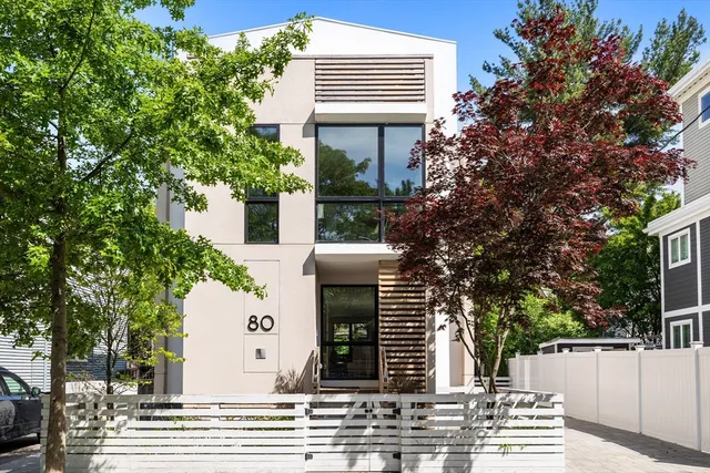 a view of a house with a tree