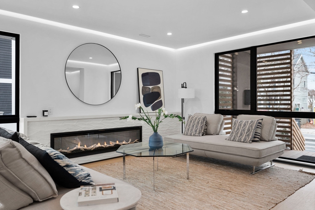 80 Alpine Street Cambridge, MA 02138 - Photo 15 of 41 a living room with furniture and a fireplace