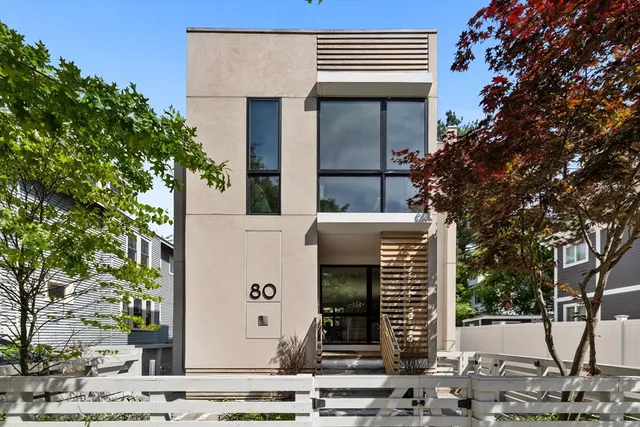 front view of a house with a tree