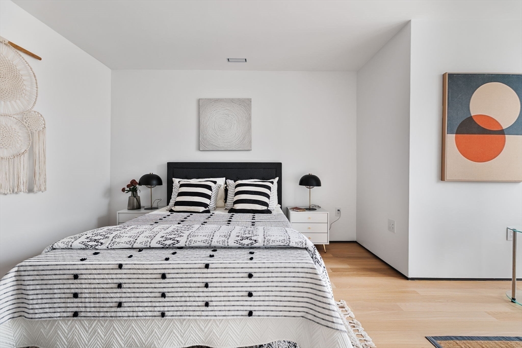 80 Alpine Street Cambridge, MA 02138 - Photo 23 of 41 a bedroom with a bed and a painting on the wall