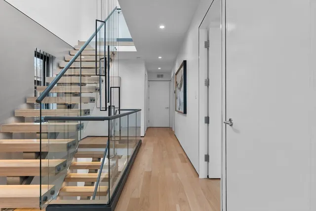 a bedroom with a large bed and a large window