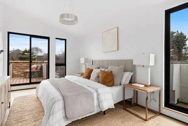 a bedroom with furniture and a window