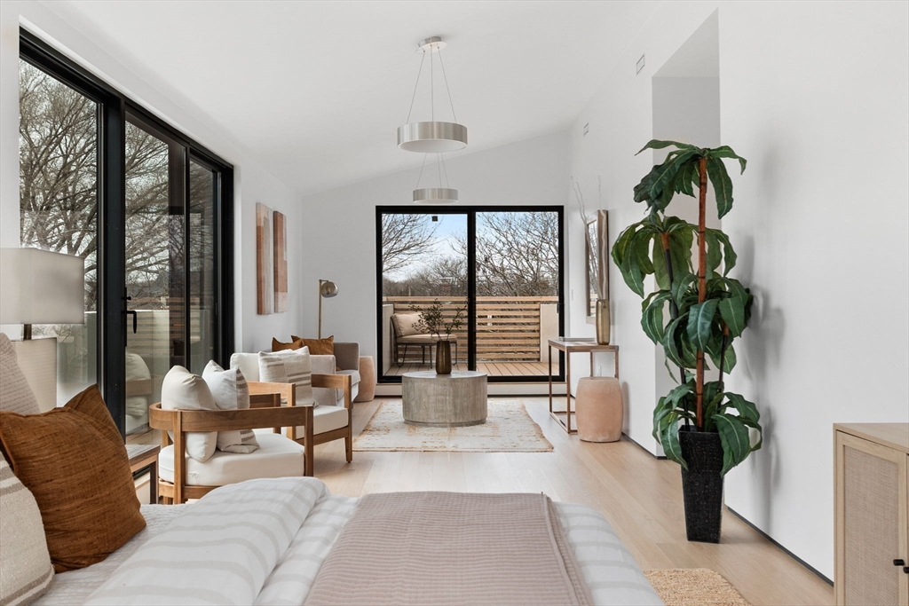 80 Alpine Street Cambridge, MA 02138 - Photo 29 of 41 a living room with furniture a potted plant and a large window