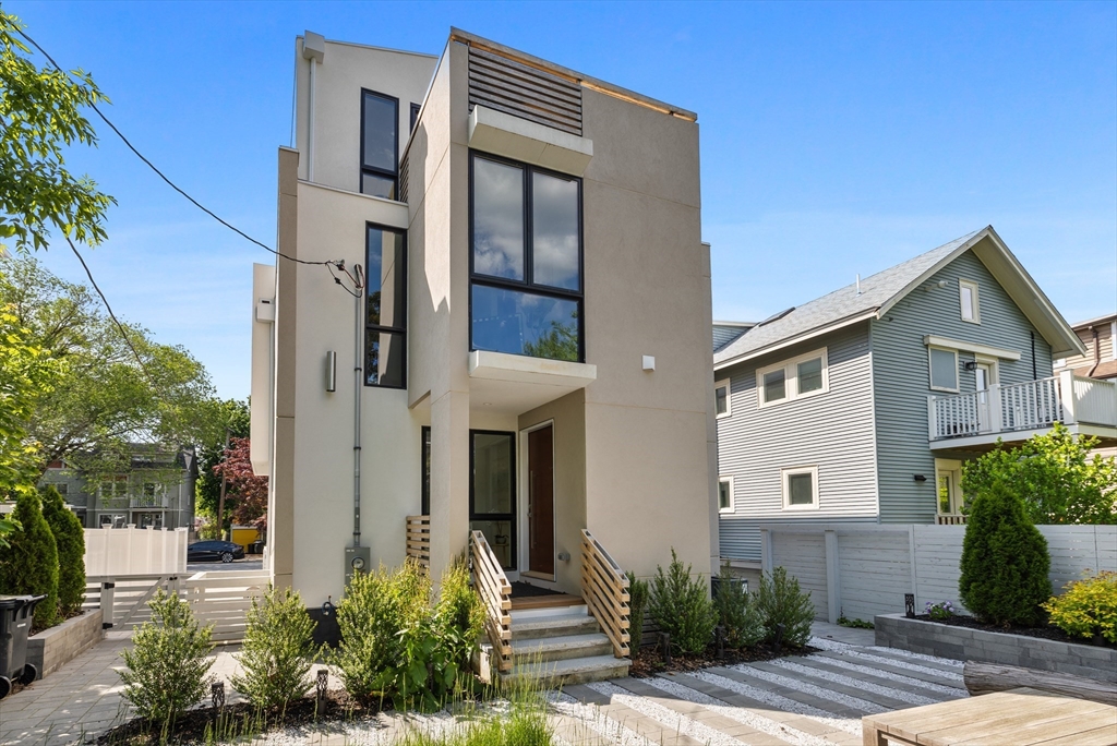 80 Alpine Street Cambridge, MA 02138 - Photo 3 of 41 a front view of a house with a yard