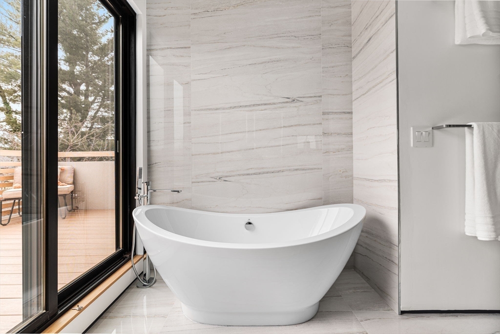 80 Alpine Street Cambridge, MA 02138 - Photo 31 of 41 a white bath tub sitting next to a vanity