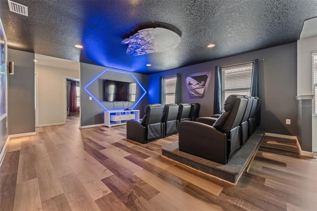 2108 Morocco Way Kissimmee, FL 34747 - Photo 13 of 57 a living room with furniture and a flat screen tv