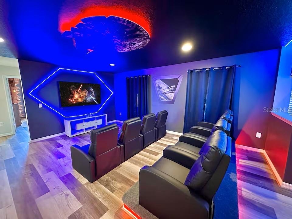 2108 Morocco Way Kissimmee, FL 34747 - Photo 16 of 57 a living room with furniture a projector and a rug