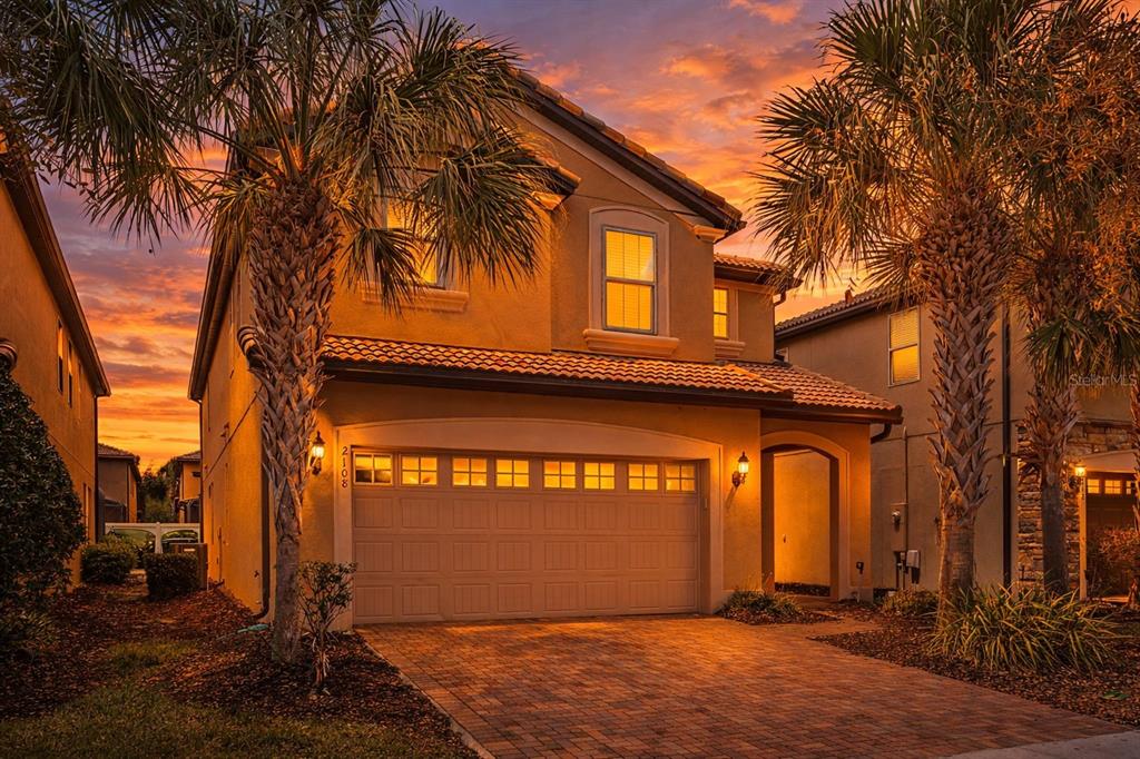 2108 Morocco Way Kissimmee, FL 34747 - Photo 2 of 57 a view of a house with a yard