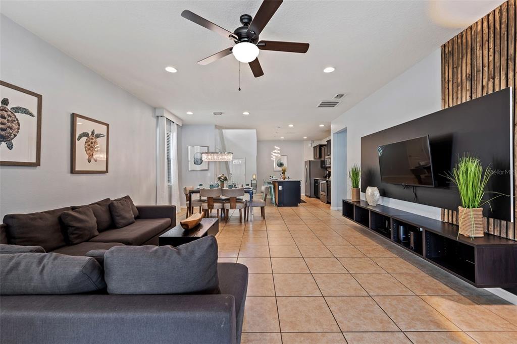 2108 Morocco Way Kissimmee, FL 34747 - Photo 27 of 57 a living room with furniture and a flat screen tv