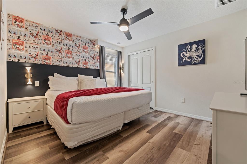 2108 Morocco Way Kissimmee, FL 34747 - Photo 28 of 57 a bedroom with a bed and a ceiling fan