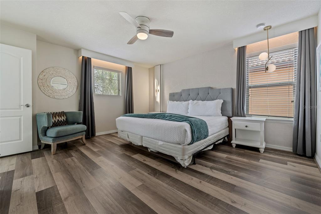 2108 Morocco Way Kissimmee, FL 34747 - Photo 30 of 57 a bedroom with a bed wooden floor and window