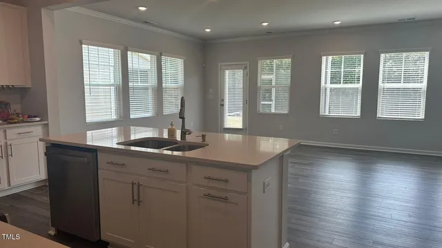 a kitchen with sink and window