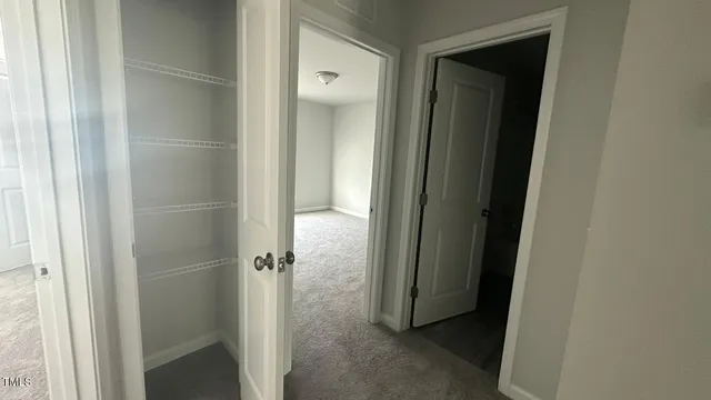 an empty room with a empty space and windows