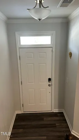 a view of room with wooden floor