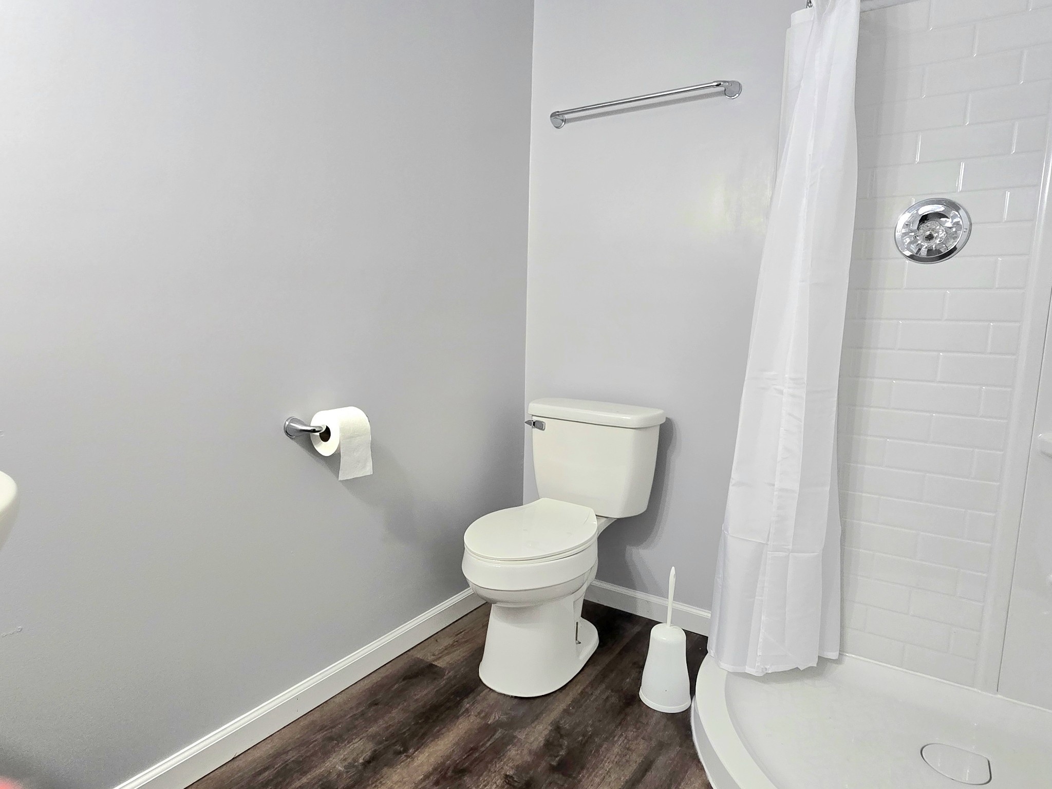 118 Bone Cave Road Rock Island, TN 38581 - Photo 19 of 52 a white toilet sitting next to a white sink and vanity