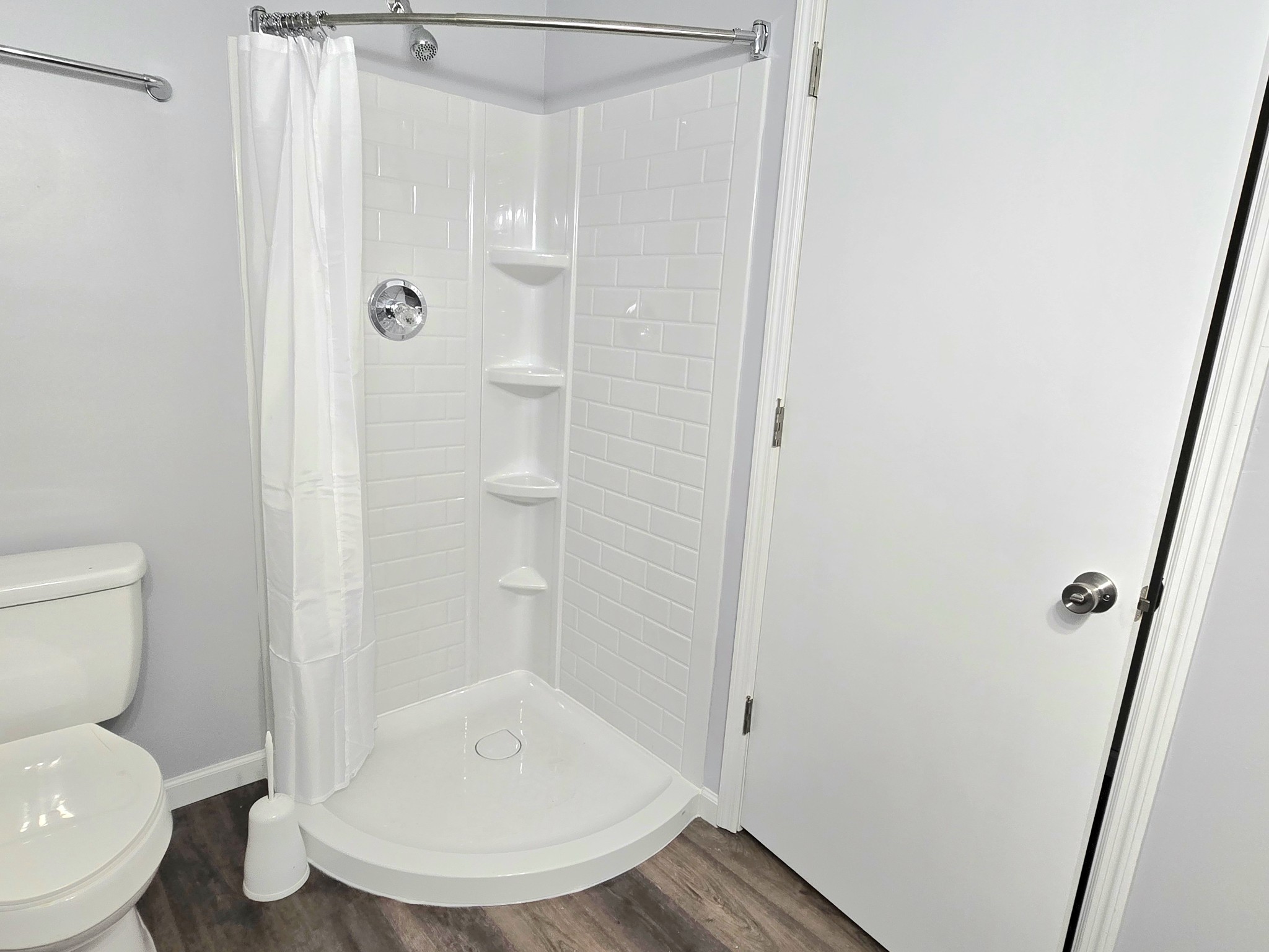 118 Bone Cave Road Rock Island, TN 38581 - Photo 20 of 52 a bathroom with a toilet and a shower