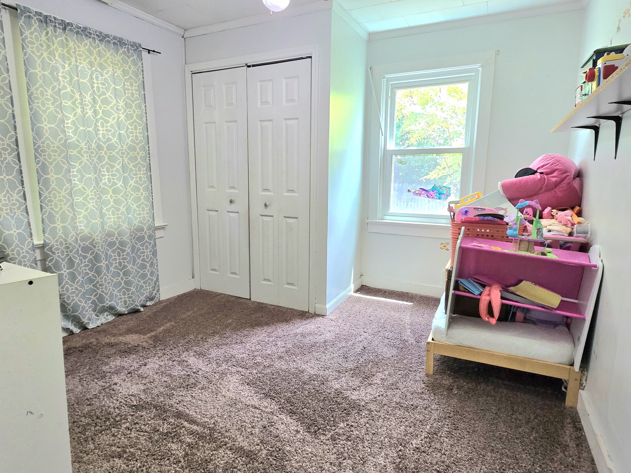 118 Bone Cave Road Rock Island, TN 38581 - Photo 27 of 52 a bedroom with a bed and a window