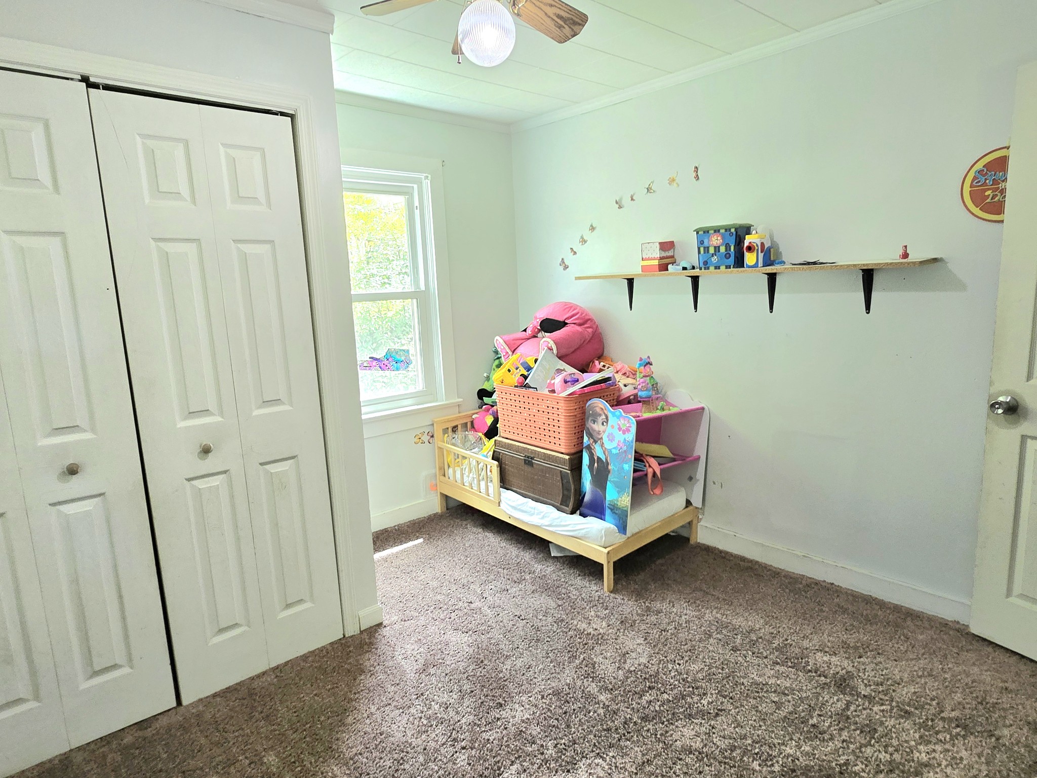 118 Bone Cave Road Rock Island, TN 38581 - Photo 28 of 52 a bedroom with baby bed and window