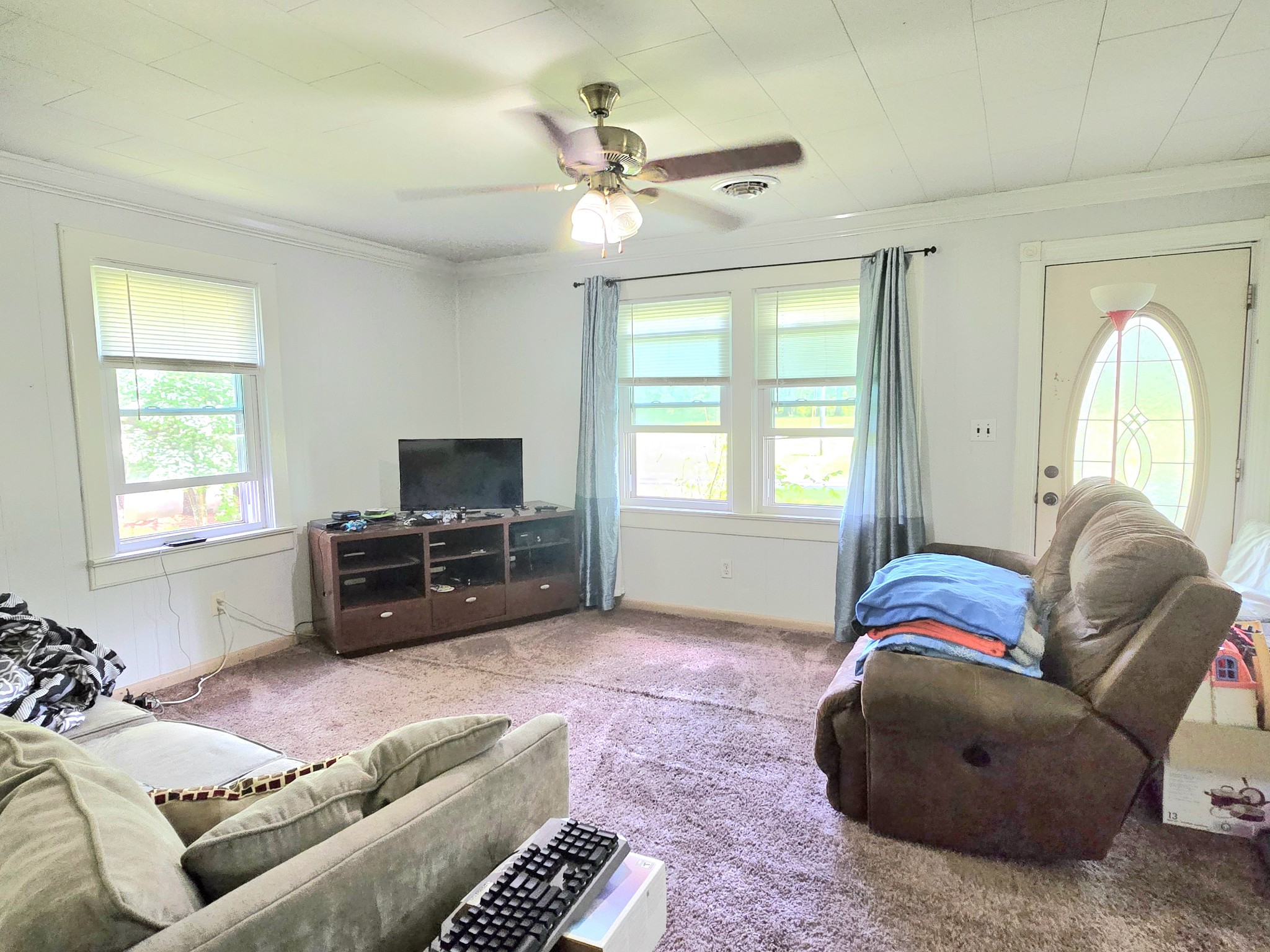 118 Bone Cave Road Rock Island, TN 38581 - Photo 7 of 52 a living room with furniture and a flat screen tv