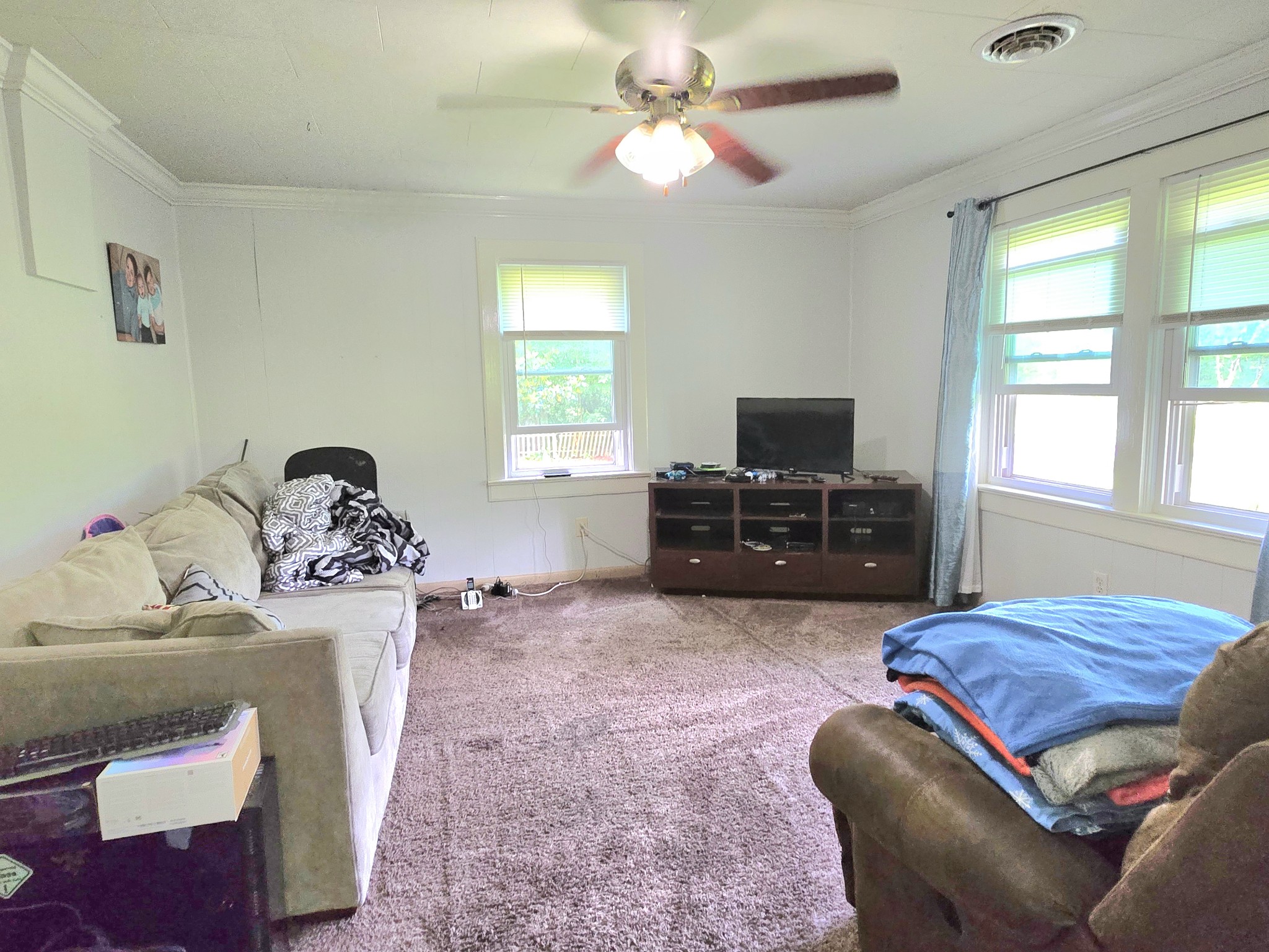 118 Bone Cave Road Rock Island, TN 38581 - Photo 9 of 52 a living room with a couch and a flat screen tv