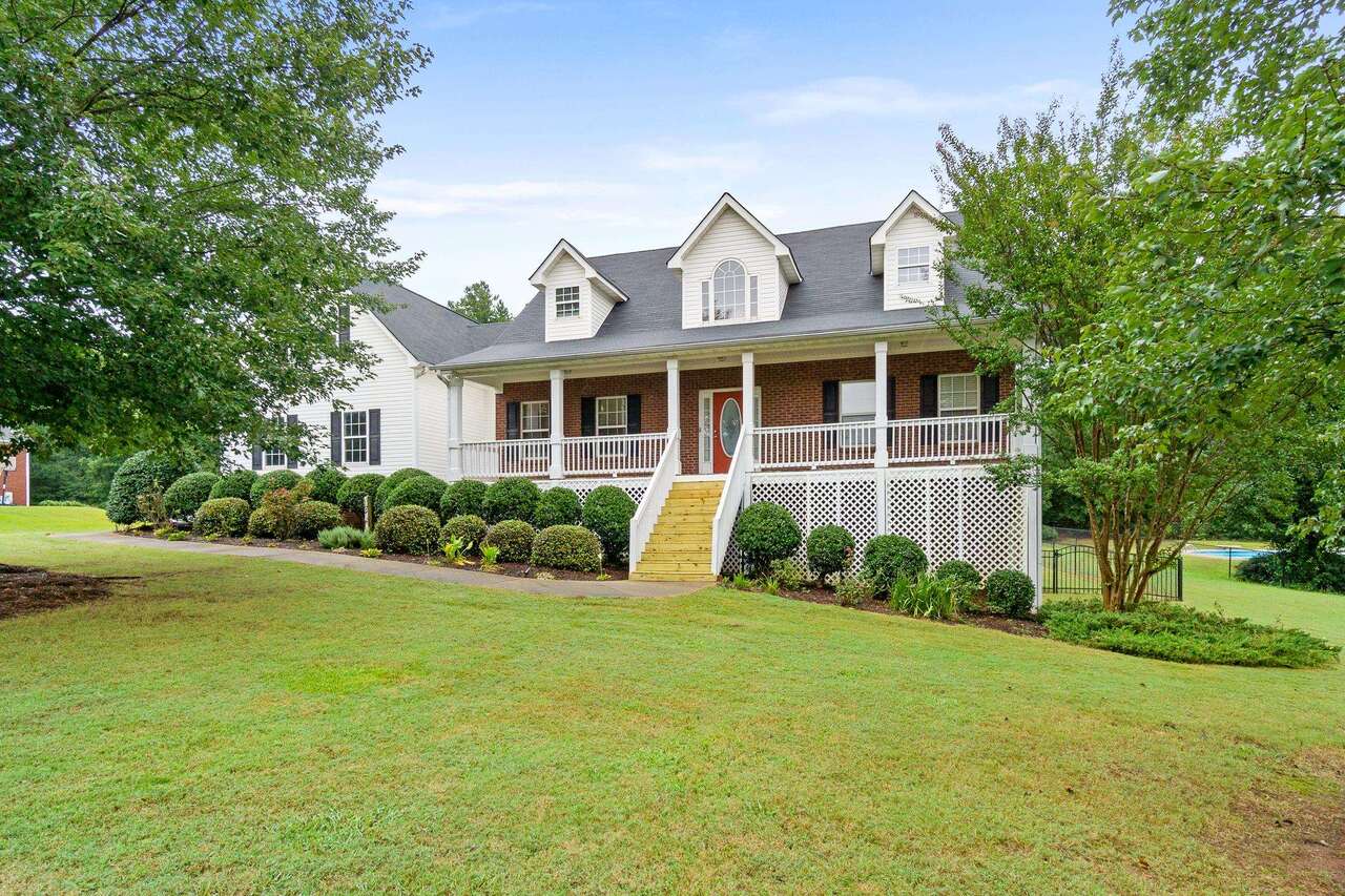 a front view of a house with garden