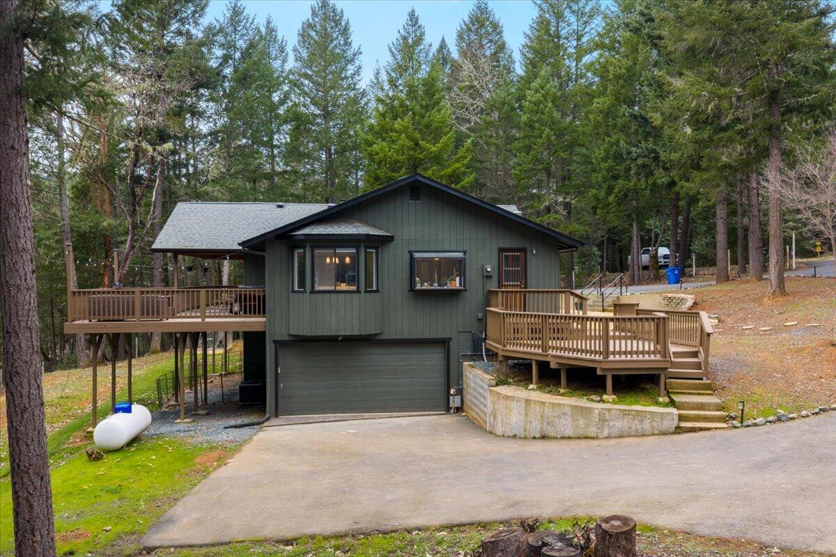 350 Splendor Drive Wilderville, OR 97543 - Photo 52 of 57 a view of house with a yard and sitting area