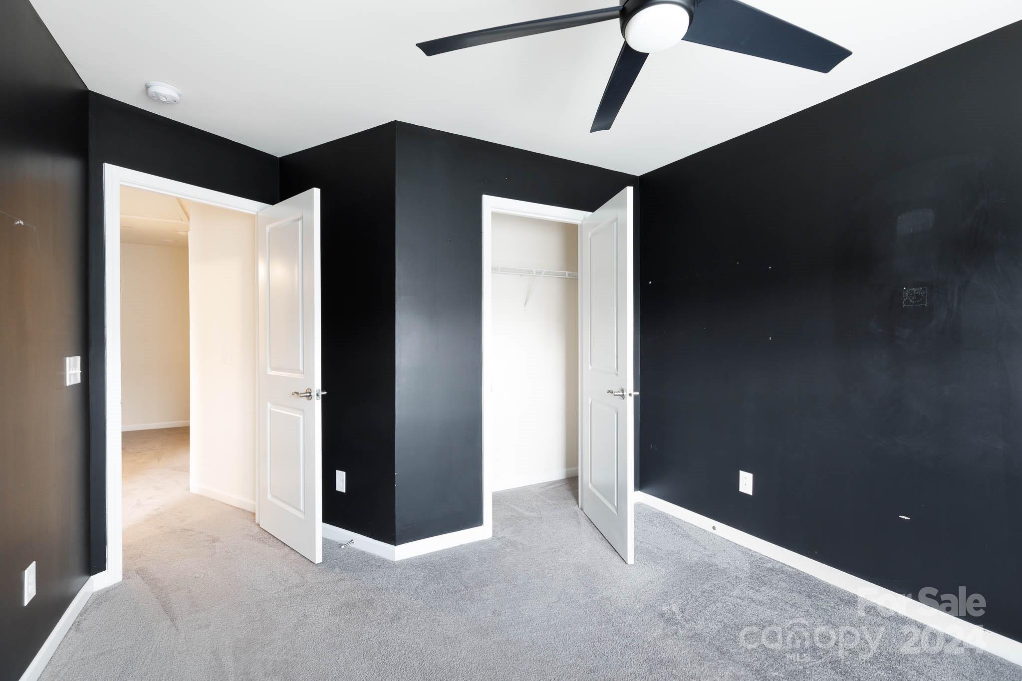 813 Canoe Song Road Fort Mill, SC 29708 - Photo 20 of 26 a view of an empty room with a ceiling fan