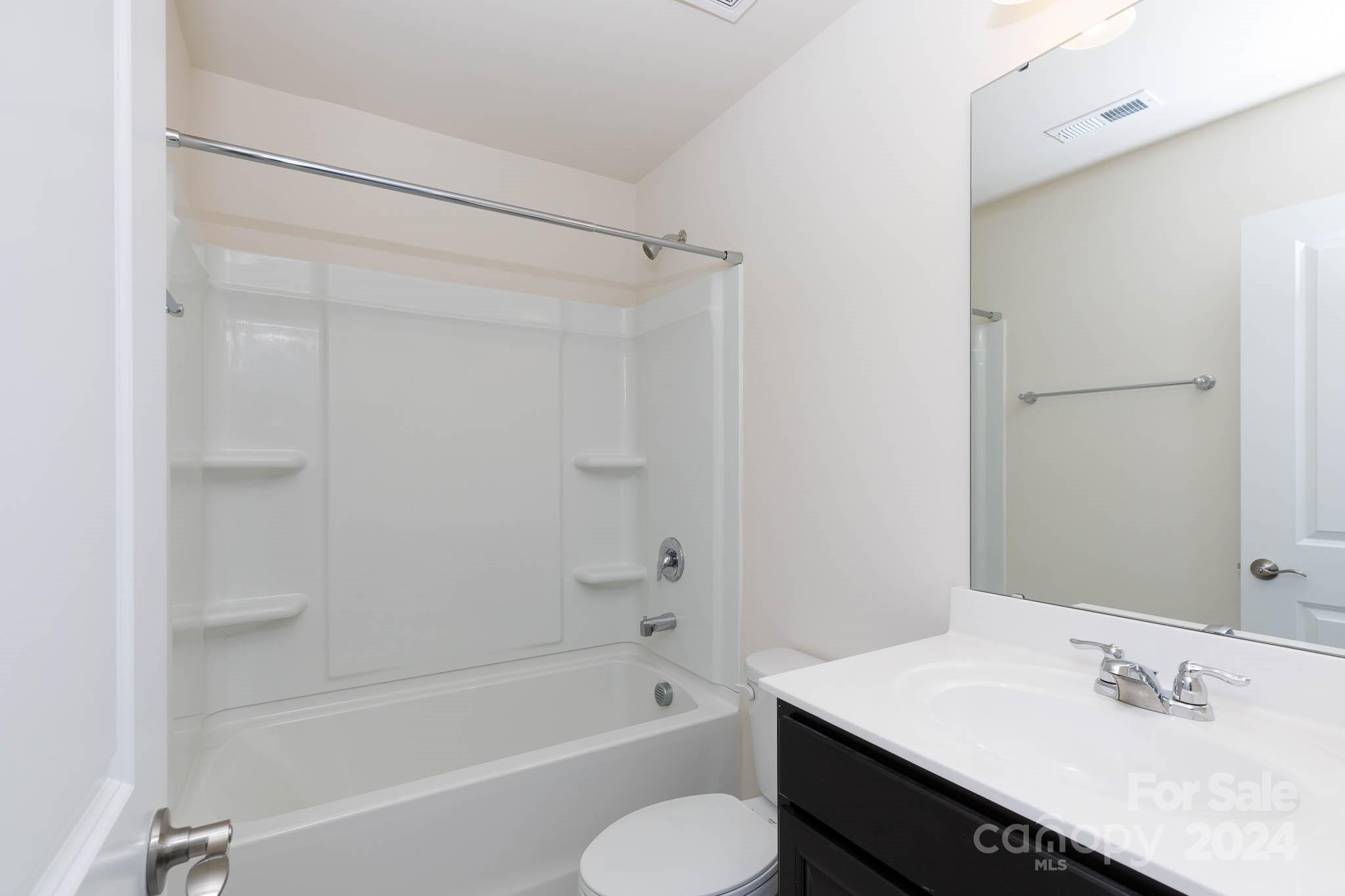 813 Canoe Song Road Fort Mill, SC 29708 - Photo 21 of 26 a bathroom with a sink toilet and shower