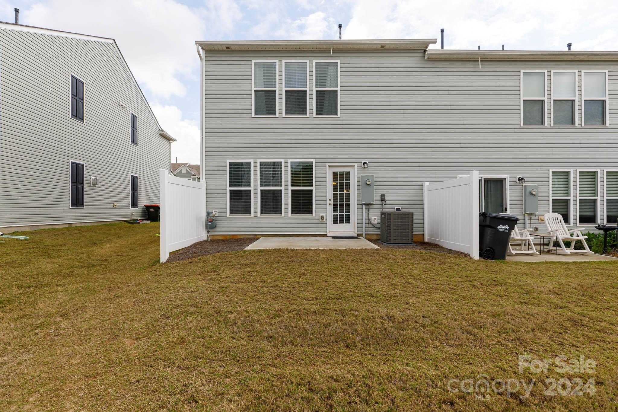 813 Canoe Song Road Fort Mill, SC 29708 - Photo 23 of 26 a view of a house with backyard and porch