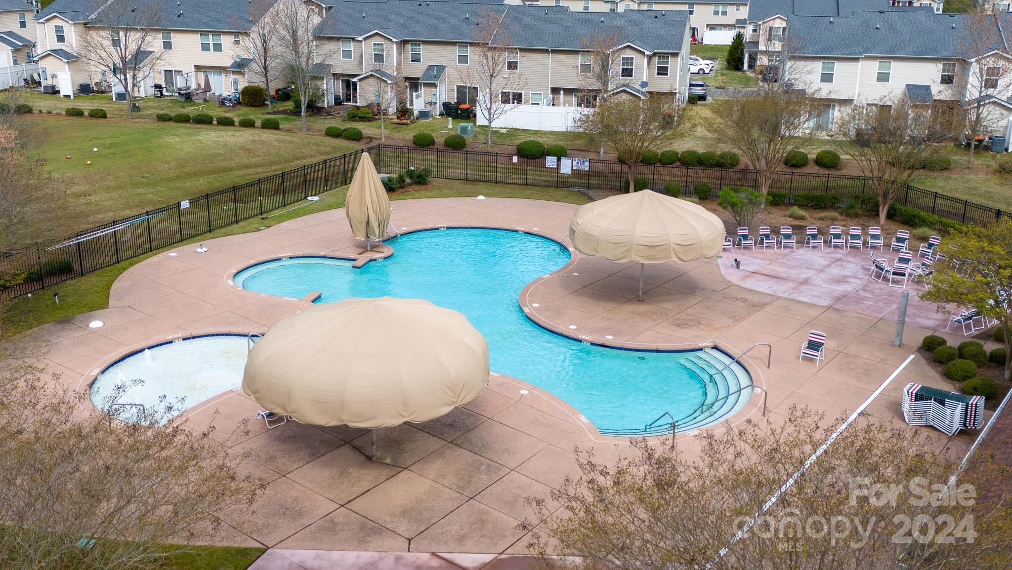 813 Canoe Song Road Fort Mill, SC 29708 - Photo 26 of 26 a swimming pool with some tall trees