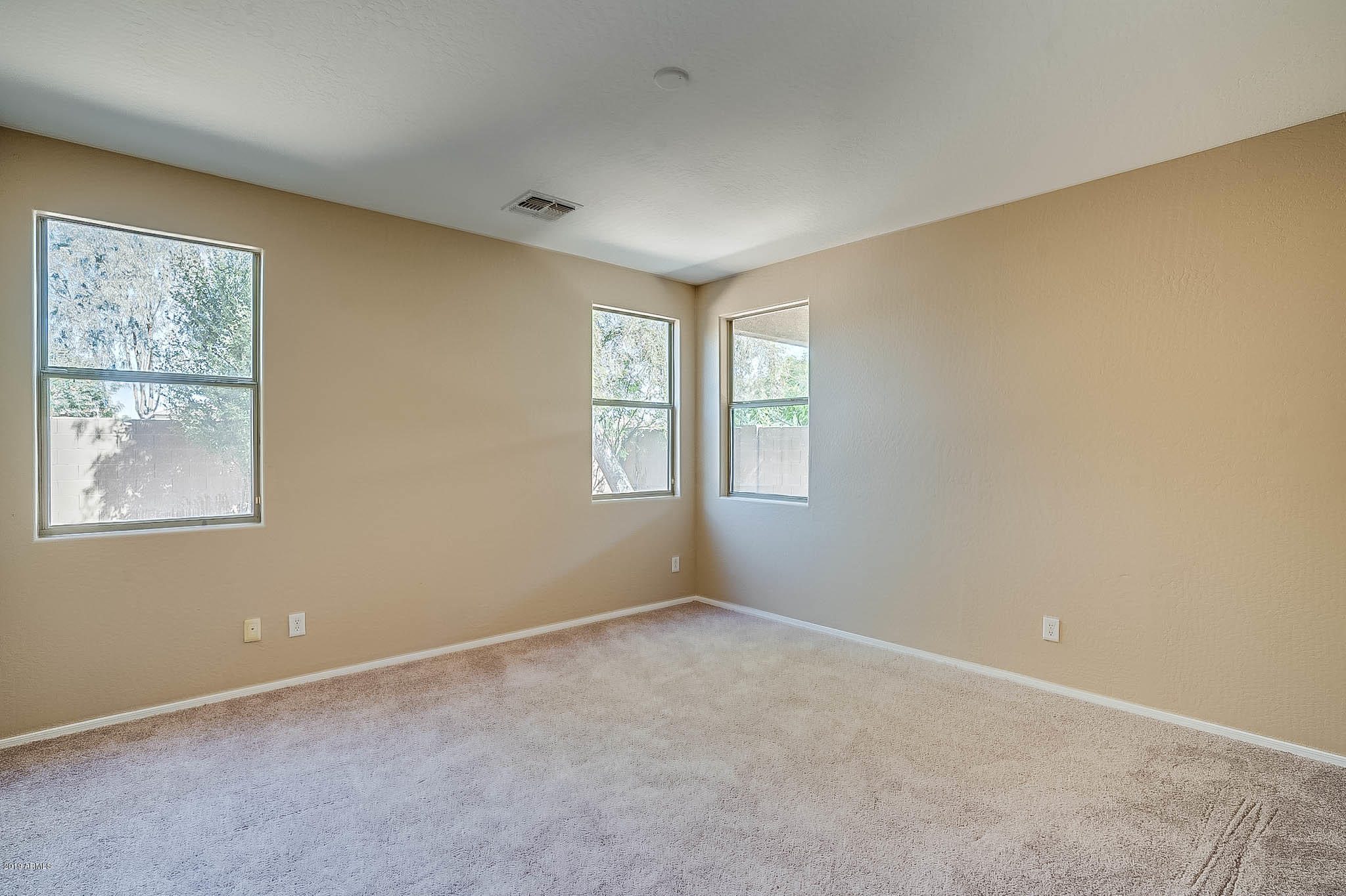 8754 West Payson Road Tolleson, AZ 85353 - Photo 12 of 19 an empty room with windows
