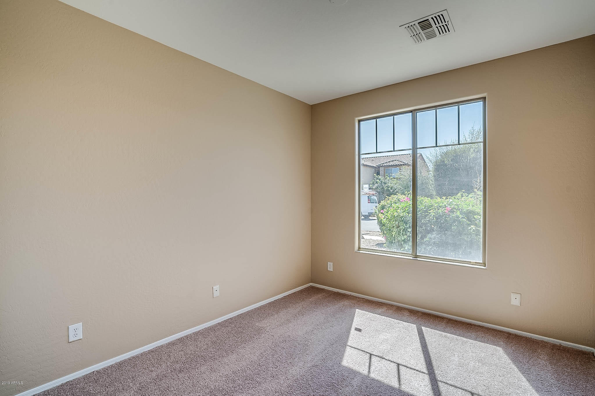 8754 West Payson Road Tolleson, AZ 85353 - Photo 16 of 19 an empty room with windows and closet