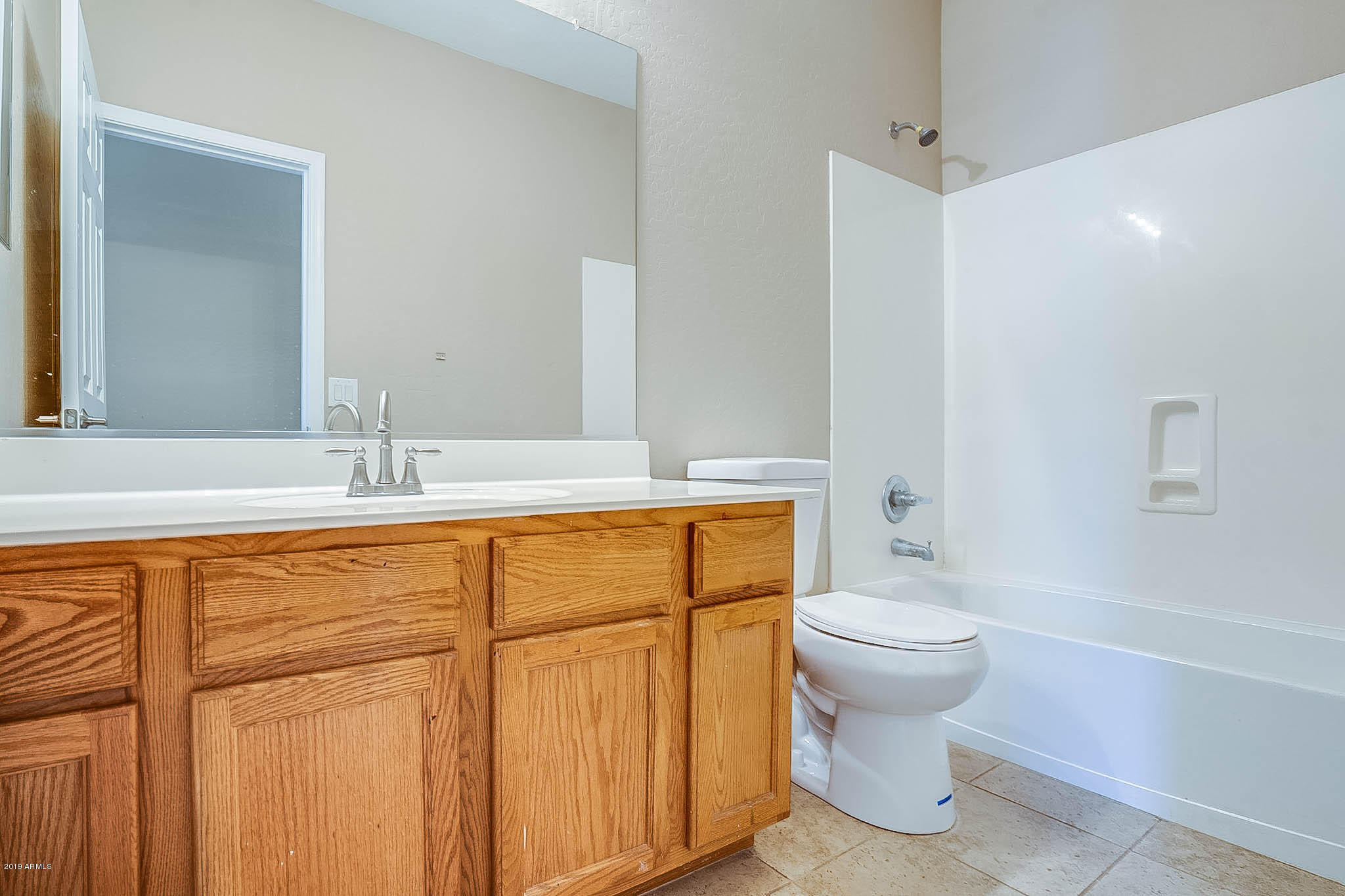 8754 West Payson Road Tolleson, AZ 85353 - Photo 18 of 19 a bathroom with a sink toilet and shower