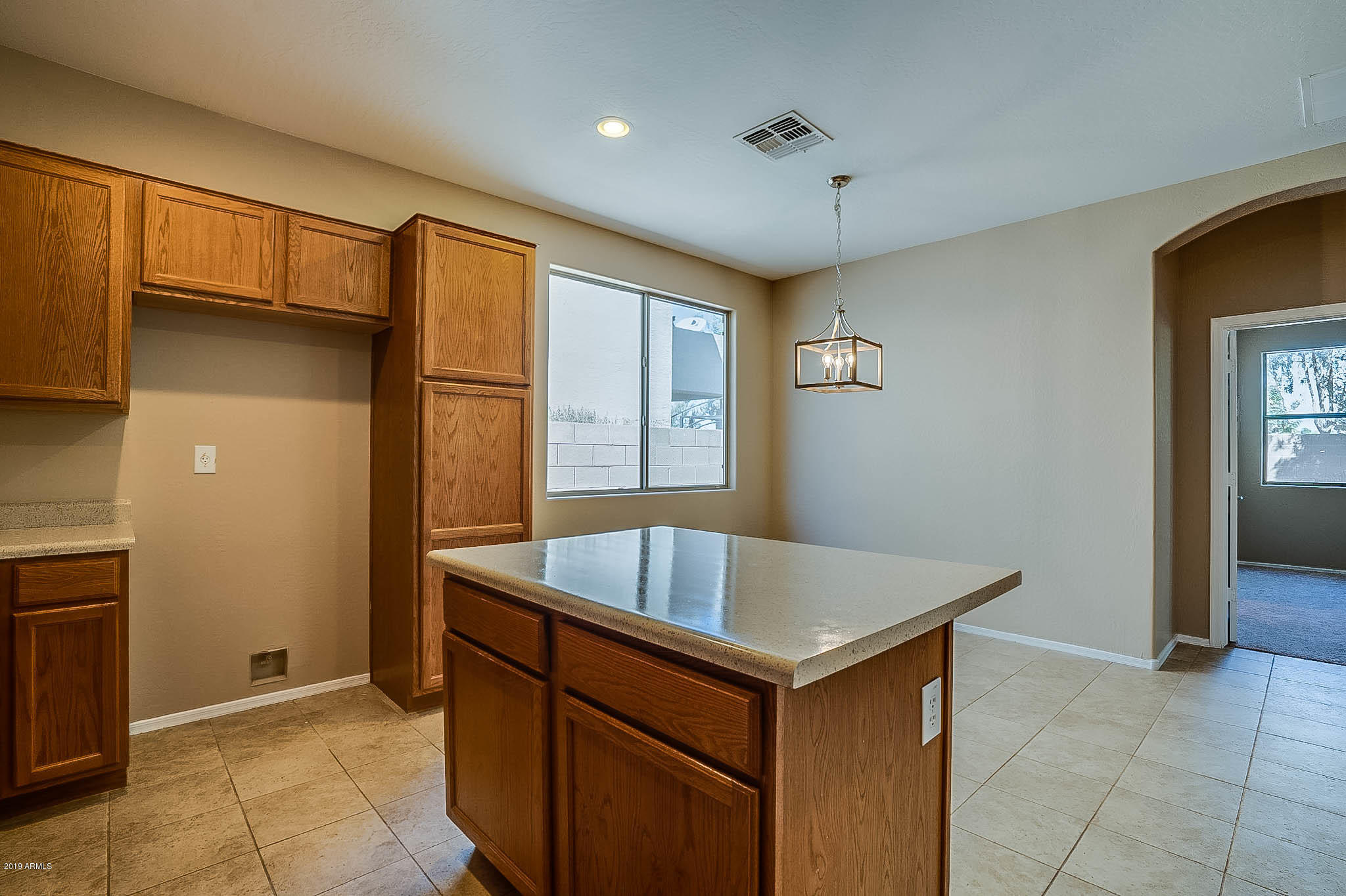 8754 West Payson Road Tolleson, AZ 85353 - Photo 2 of 19 a living room with stainless steel appliances granite countertop a sink and a refrigerator