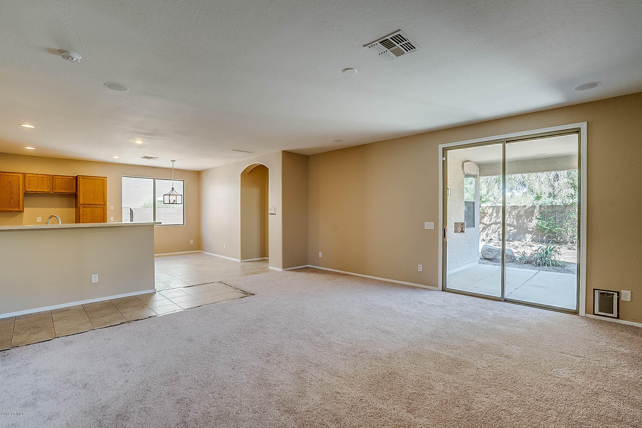 8754 West Payson Road Tolleson, AZ 85353 - Photo 3 of 19 an empty room with a empty space and windows