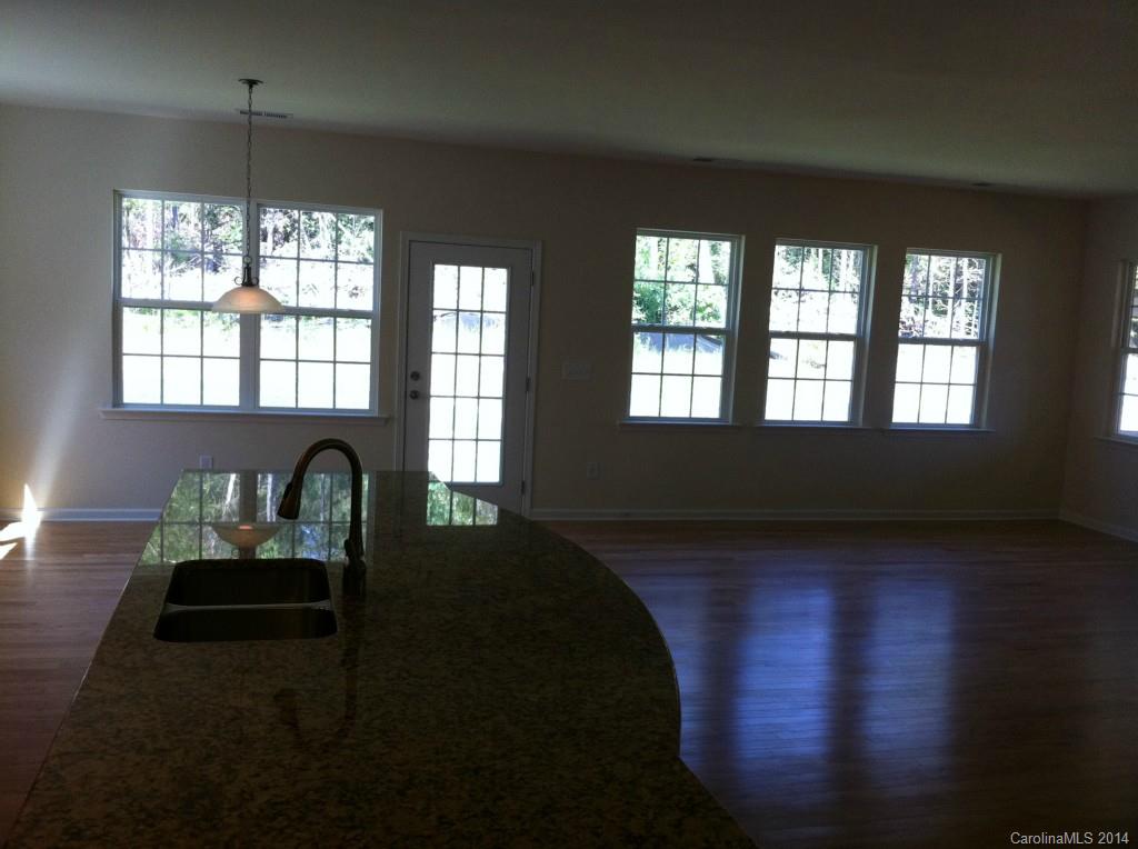 4117 Perth Road, Unit 374 Indian Land, SC 29707 - Photo 9 of 13 a living room with furniture and a floor to ceiling window