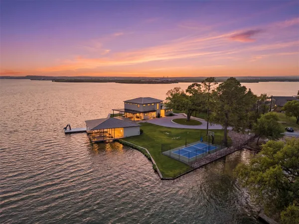 an aerial view of a house with a ocean view