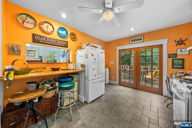 a very nice looking room with kitchen view and a large window